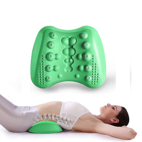 Green massage cushion being used by a person on a white background