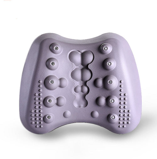 Purple massage pillow with textured surface on a white background